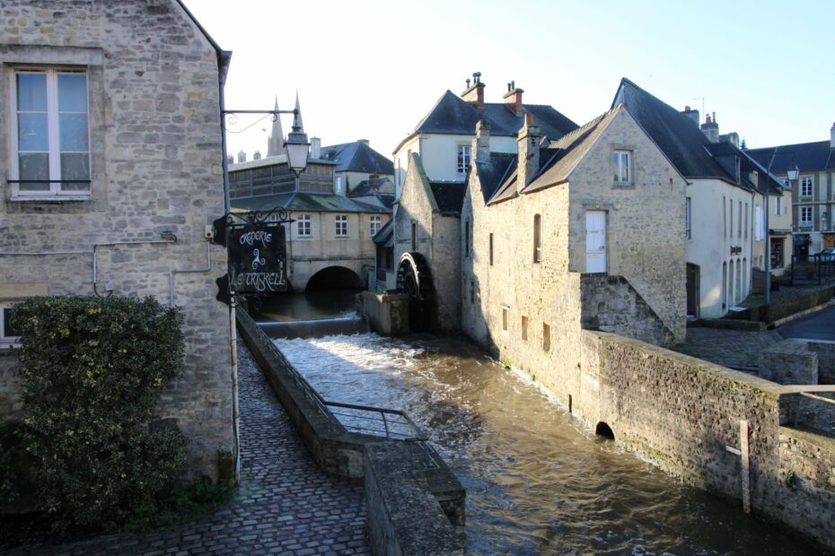 Bayeux city center crossed by the Aure river with a view of the cathedral