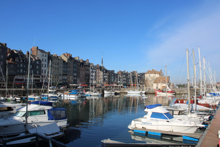 Le vieux bassin in Honfleur, Normandy with private boats in the harbor.