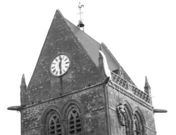 The parachute hung onto the church bell tower in Sainte Mère Eglise, Normandy