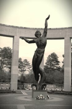 Statue The spirit of American youth rising from the waves at the US cemetery, Omaha Beach, Normandy