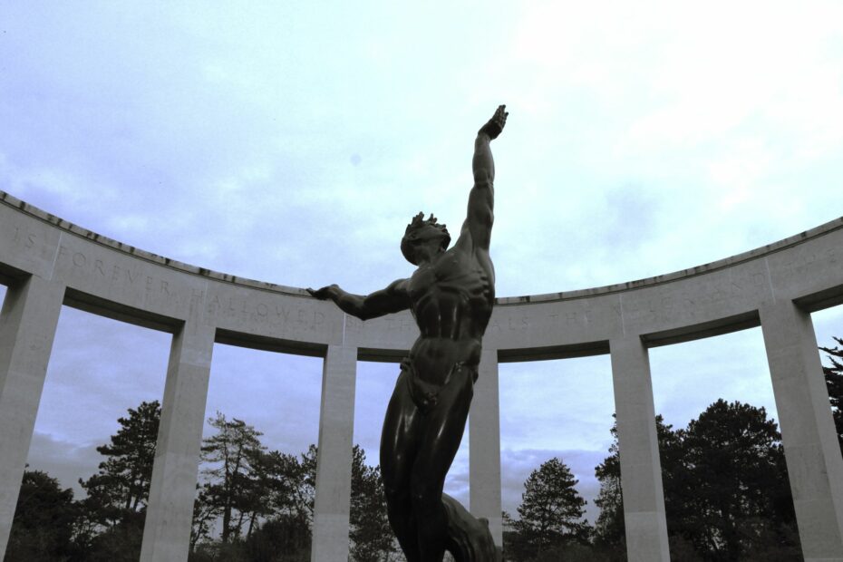 Statue of The spirit of American youth rising from the waves at the US cemetery, Omaha Beach, Normandy